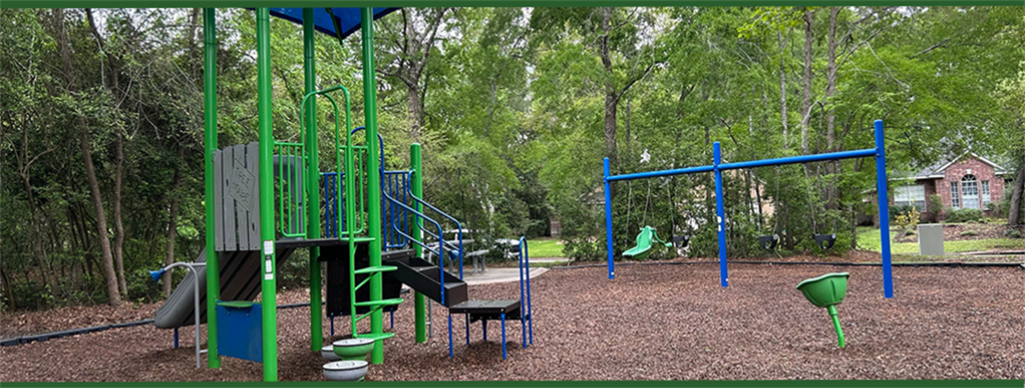 Photo of playground with swings and slides