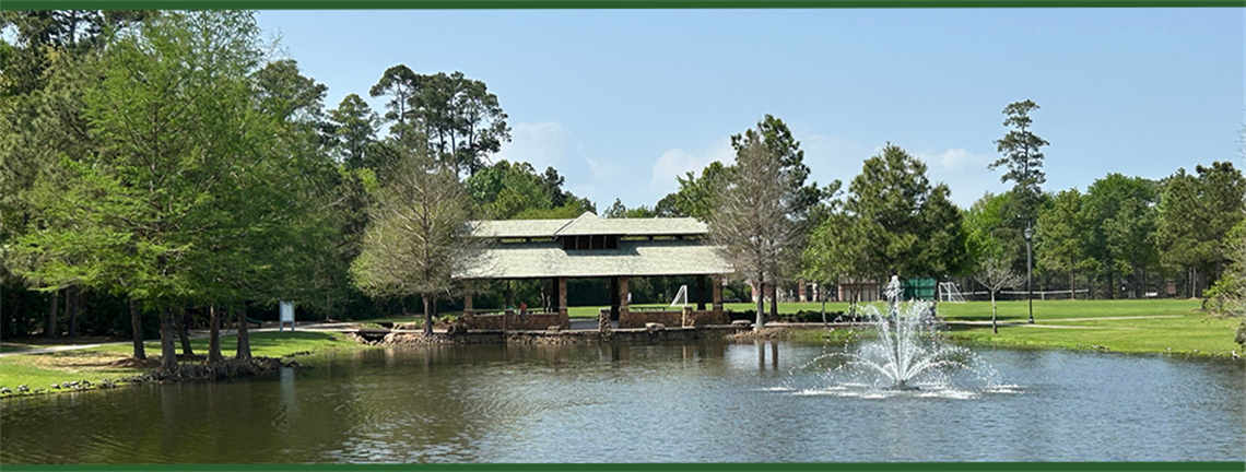 Photo of pavilion and park pond with fountain