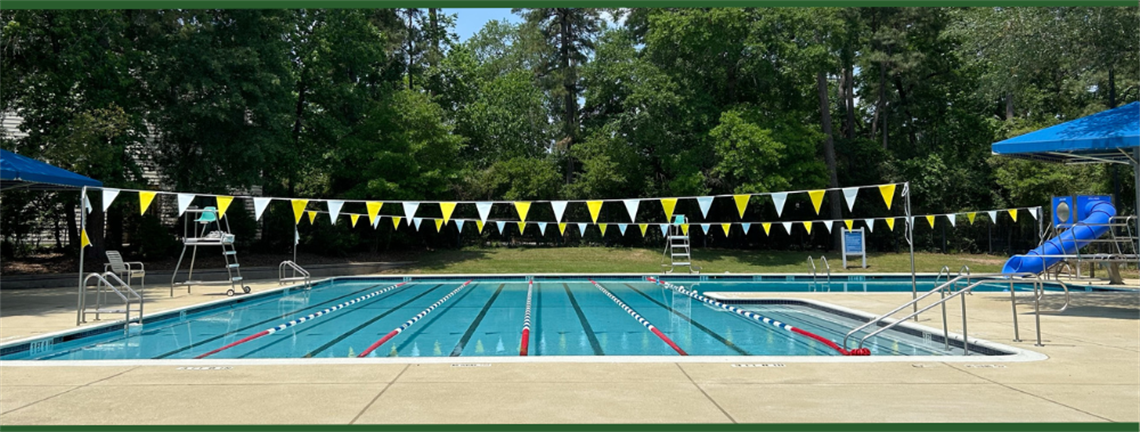 A swimming pool with lap lanes and slides