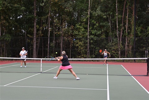 Tennis players on a green court